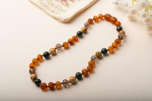 Baltic Amber Teething & Pain Jewelry in 'River'